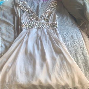 A grey rhinestone BeBe dress